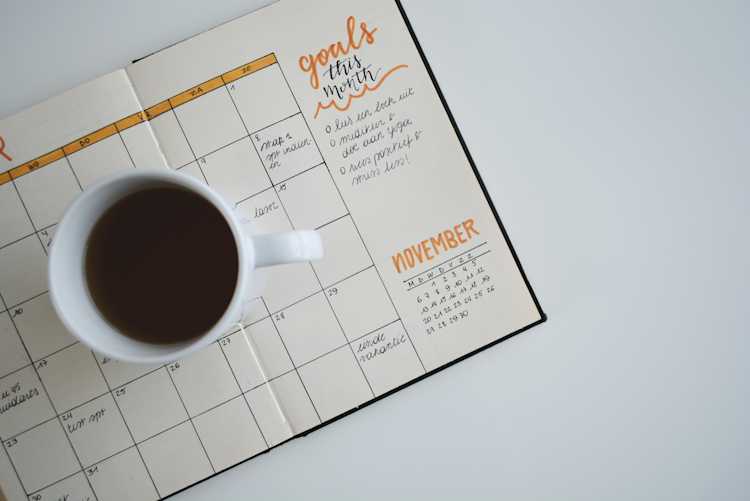 Calendar with a cup of coffee.