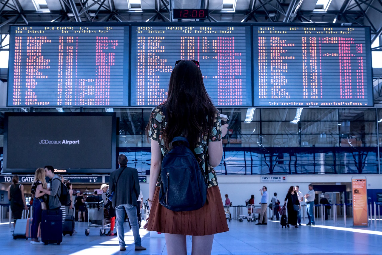 Women looking at flight statuses