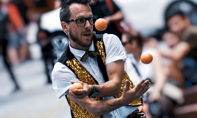 Entertainer juggling at a festival in Kitchener