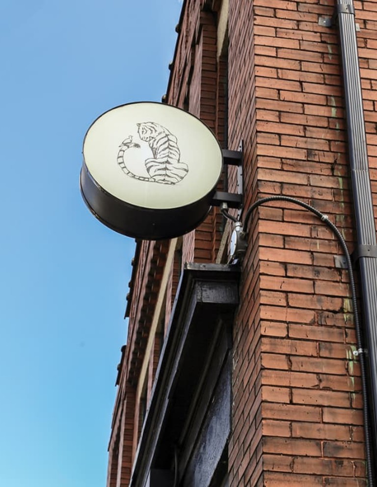 Smile Tiger sign on the side of the building