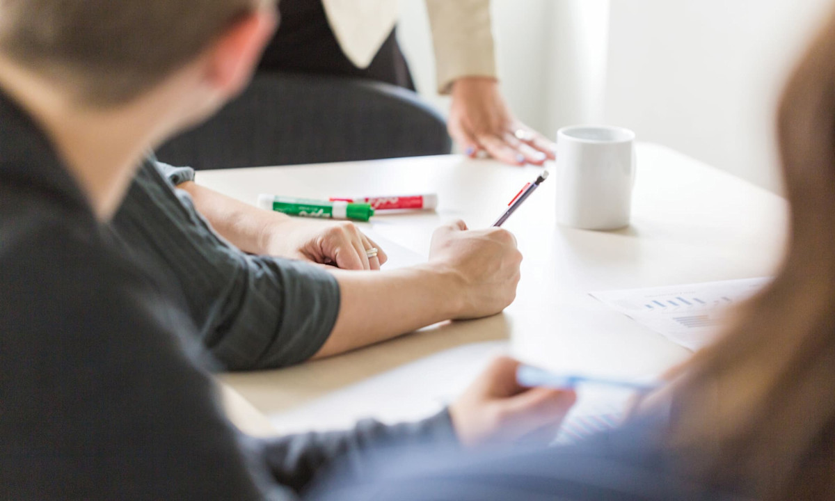 Team sitting at a table having a meeting