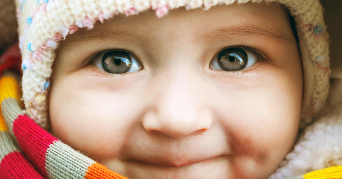 baby in scarf and hat