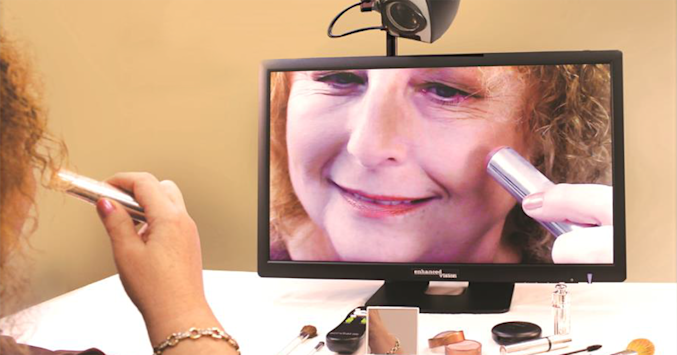 person using magnifying camera low vision aid