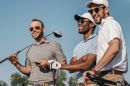 Three male golfers wearing sunglasses.