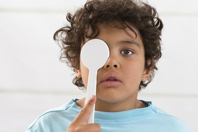 Young boy getting an eye exam