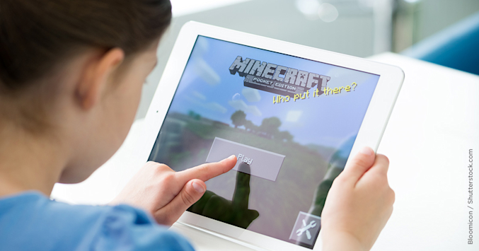 child playing game on tablet computer