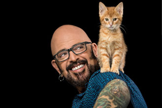 Jackson Galaxy with cat on shoulder