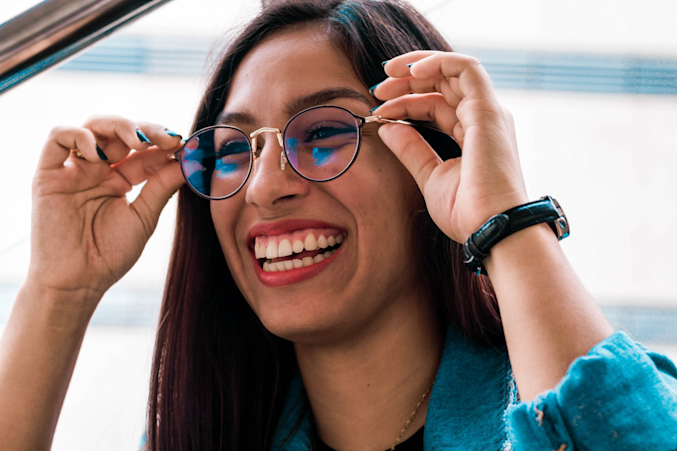 woman trying on eyeglasses