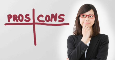 person considering pros and cons on a whiteboard