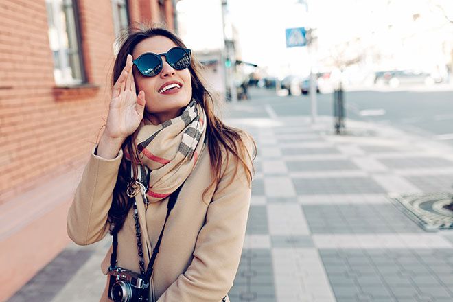 Woman wearing oval shaped sunglasses