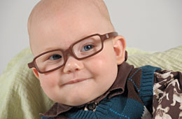 Baby with brown eyeglasses