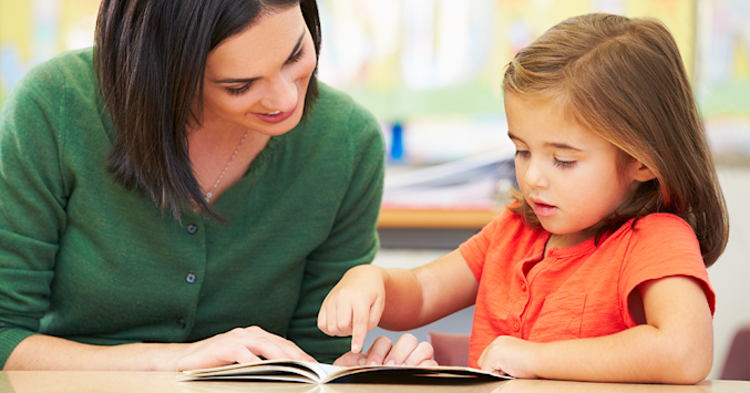 mother reading to daughter