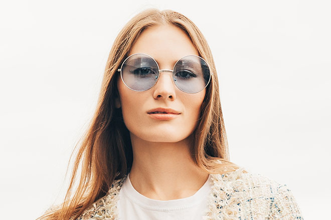 Woman wearing oval shaped sunglasses