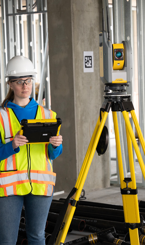 female construction worker working with Trimble Ri