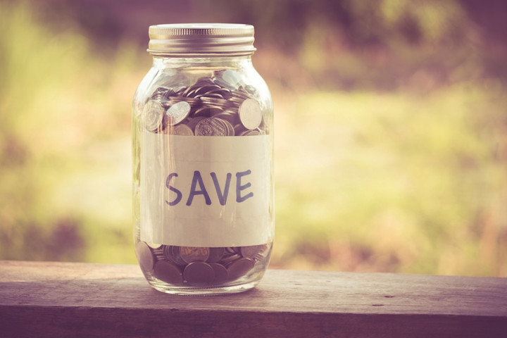 Jar of money labeled savings.