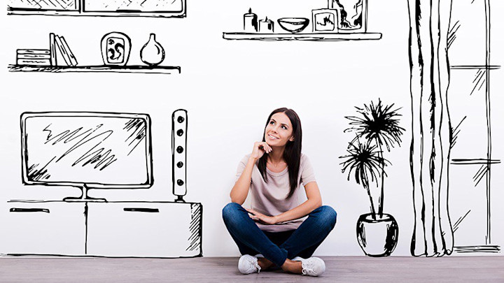 A woman imagines a layout for her apartment.