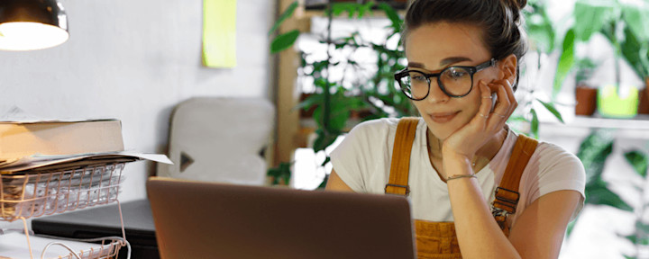A woman shopping for life insurance on her computer.