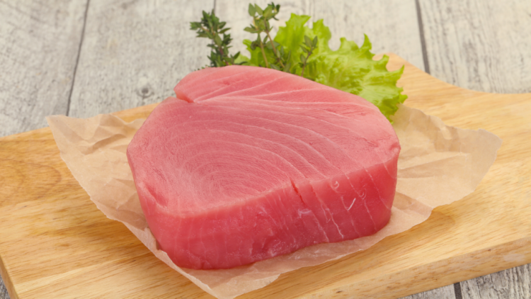 Tuna steak being prepared