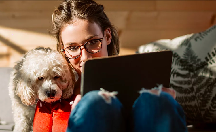 girl with dog on telehealth appointment