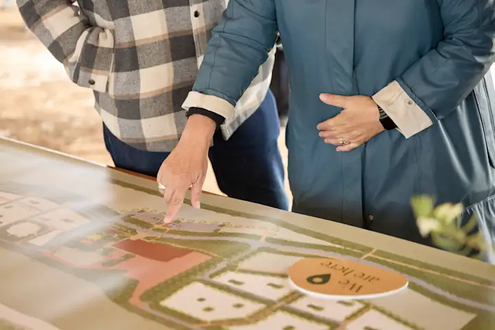 Community members review site plans together
