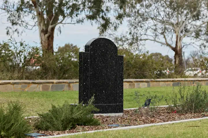Granite Headstone in Cemetery Garden