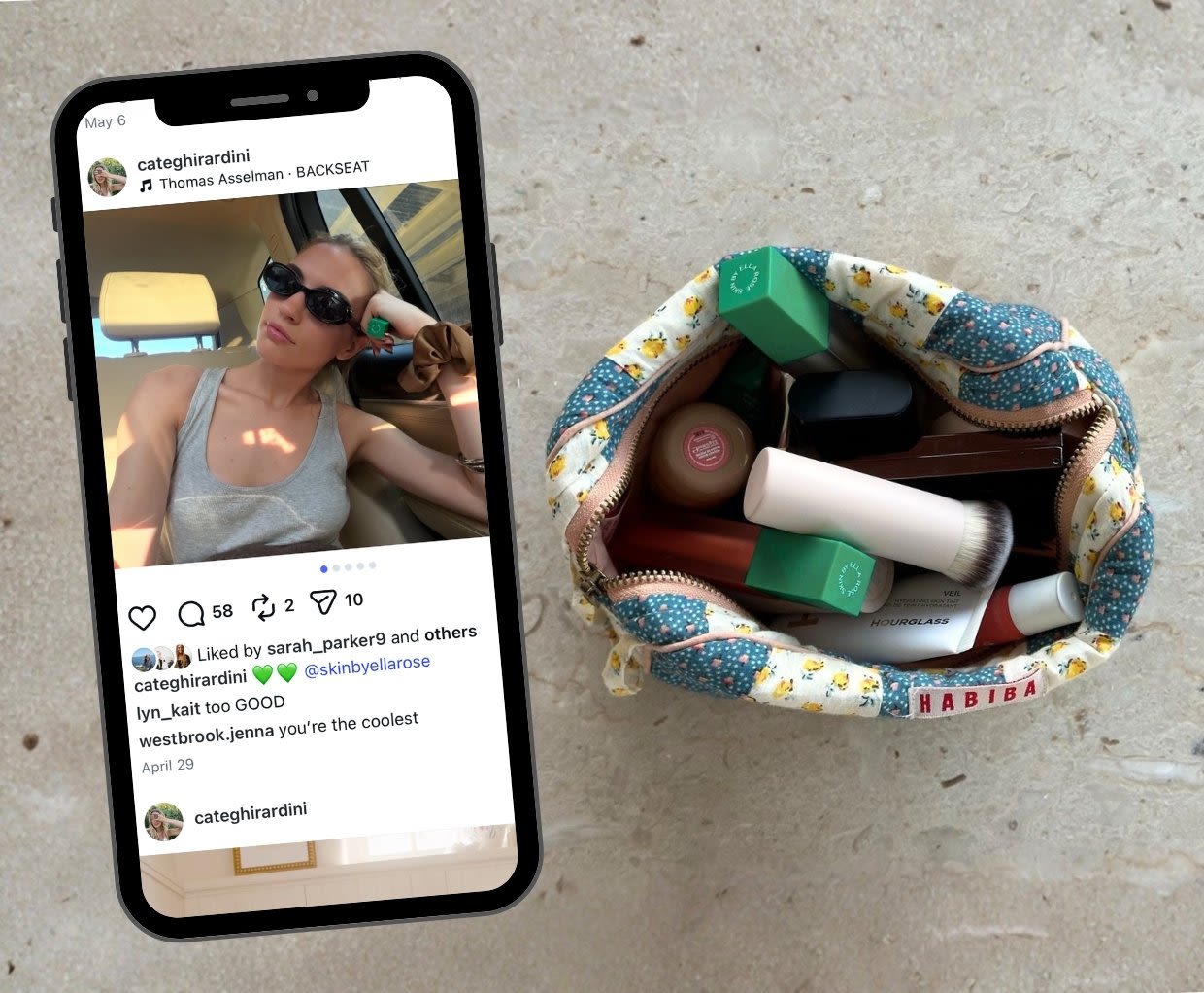 Colorful patterned bag with beauty products including bottles and compacts, displayed on concrete surface with phone showing social media posts.