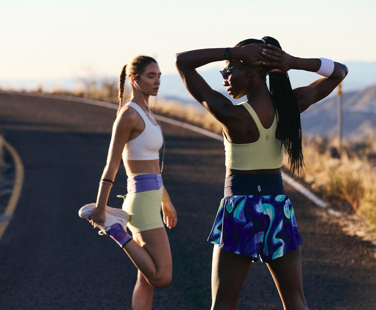 2 girls in running gear on road