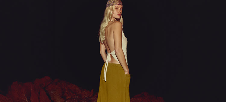 Four fashion shots of a blonde model wearing various retro-style outfits including beaded headbands and backless tops.