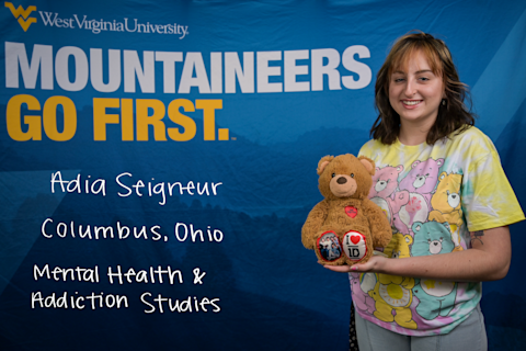 Adia Seigneur, a Mental Health and Addiction Studies major from Columbus, Ohio, wears a Care Bear shirt and holds