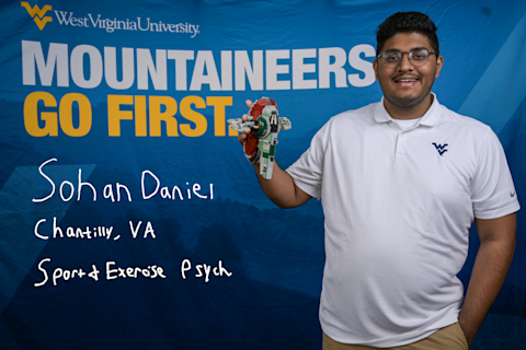 Sohan Daniel, a Sport and Exercise Psychology major from Chantilly, VA, holds a Star Wars figurine.
