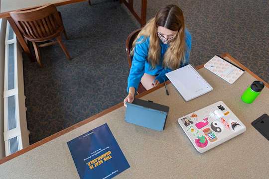 Student studying alone at a table
