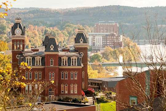 Fall view of Woodburn Hall with Monongahela River and Morgantown