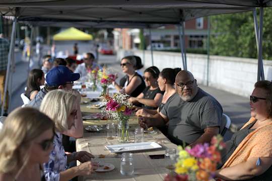 Guests at table interact during an event
