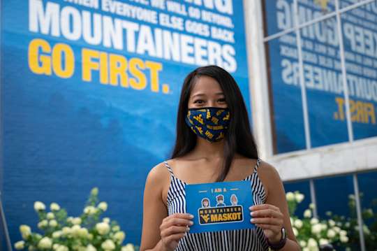 Student wearing a WVU mask