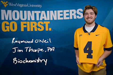 Raymond O'Neil, a Biochemistry major from Jim Thorpe, PA, displays the number four on his gold WVU jersey.