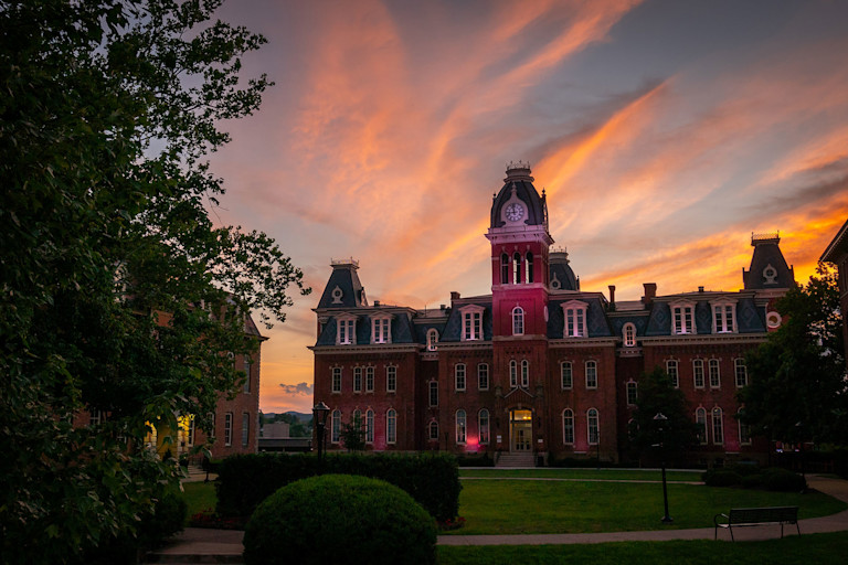 Woodburn Hall at sunset with orange and blue sky