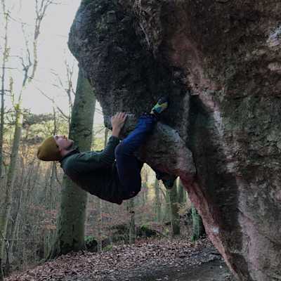 Me holding onto the rock in a frog position