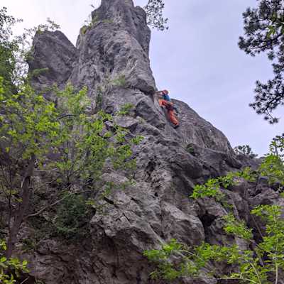 Christoph is reaching for the next hold halfway up on the route.