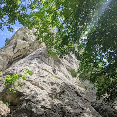 Me climbing on the rock while the sun is shining on me.