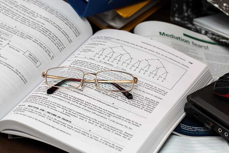Data Research with glasses on textbook