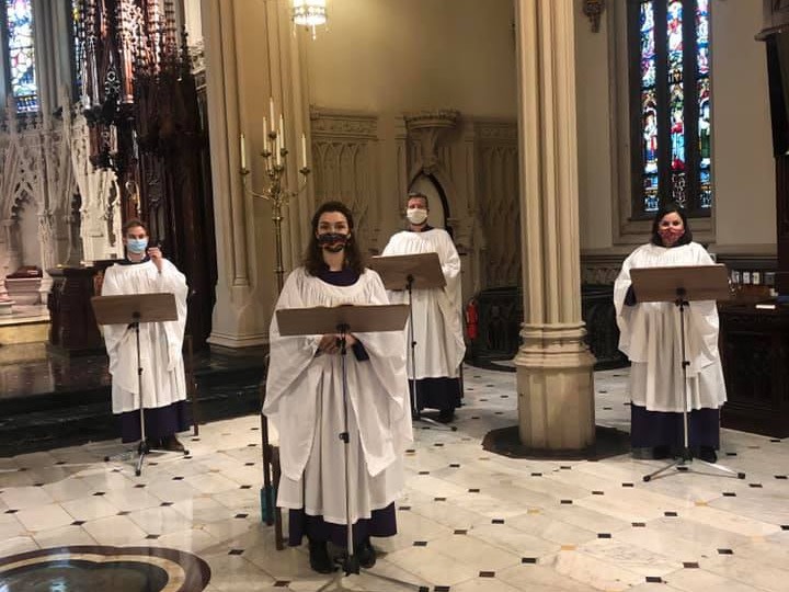 Cathedral choir singing with masks on