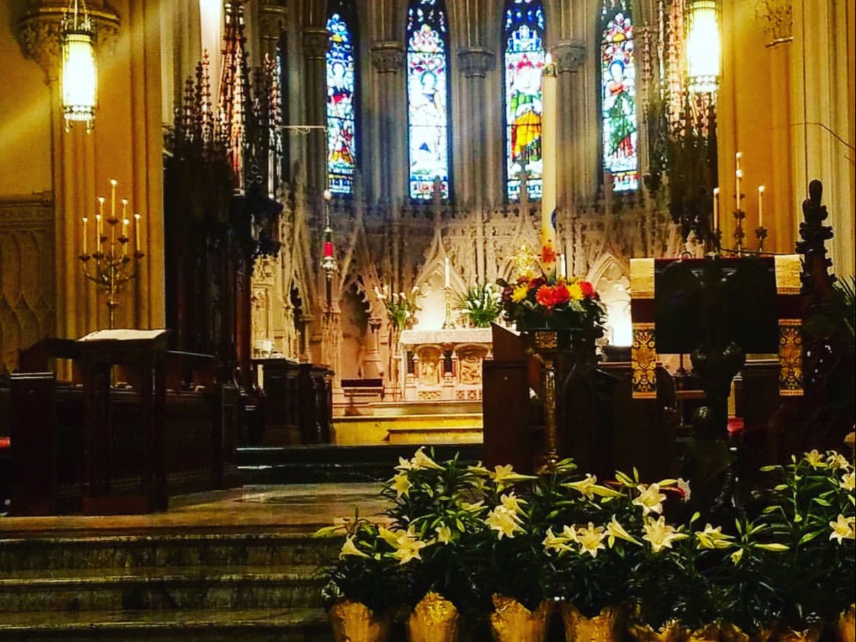 An image of the cathedral altar decorated with lilies