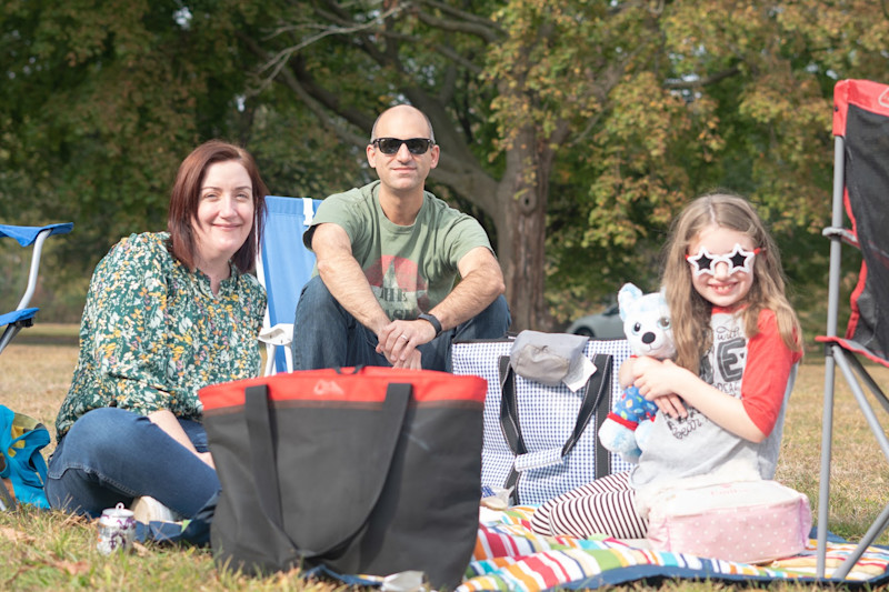 Family of three enjoying the Fellowship in Faith outdoor service