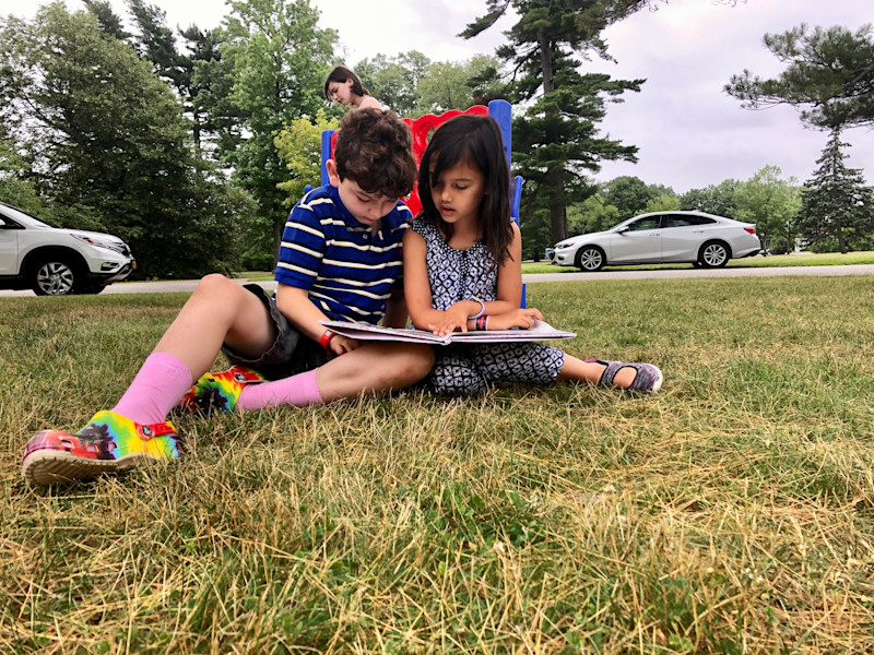 Family of three enjoying the Fellowship in Faith outdoor service