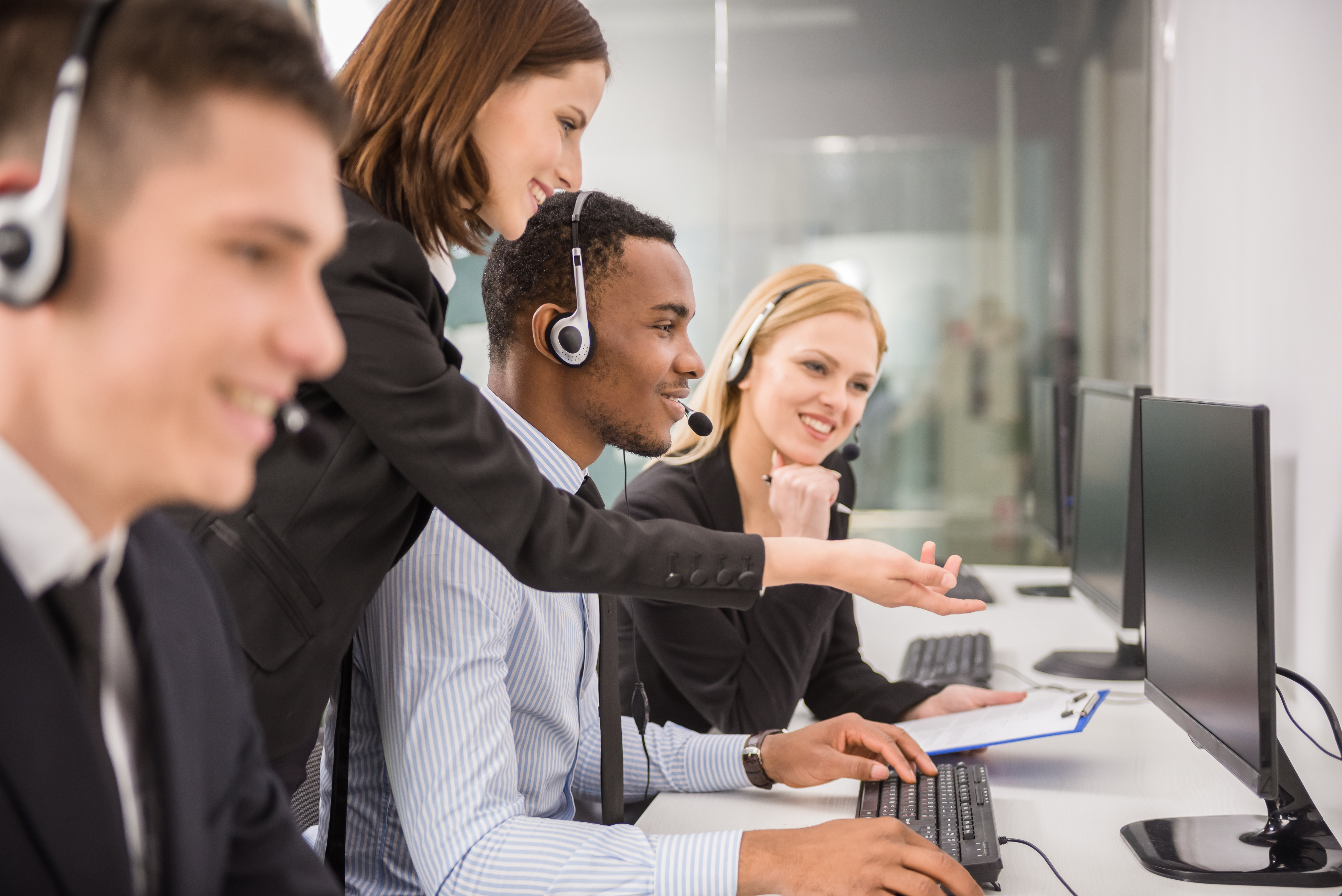 Call center agents discussing a case for quality training