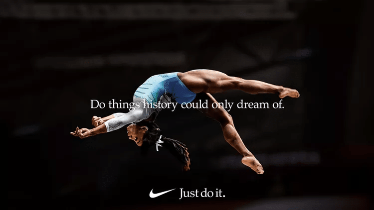 One of Nike-s ad campaigns featuring Simone Biles performing a mid-air routine