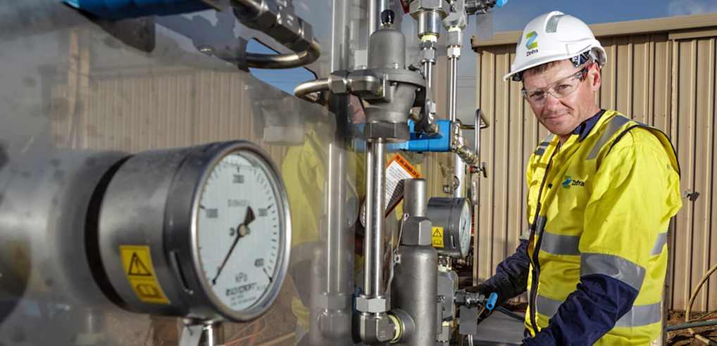 Man at a gas compressor