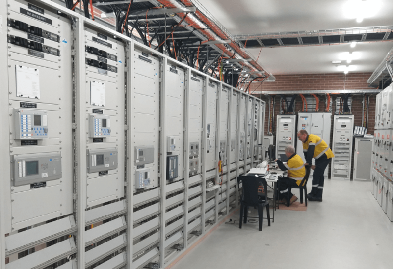 Two men working in a substation