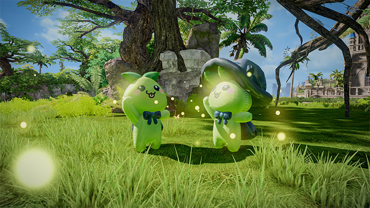 Two green figures stand in the grass chasing flashes of light.
