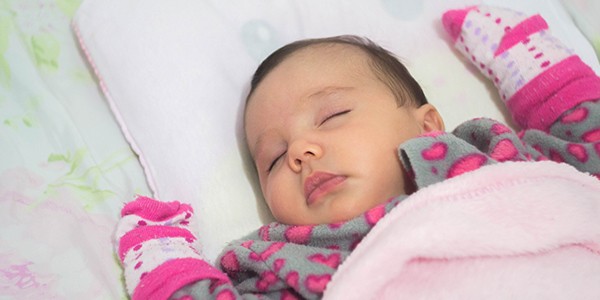 Baby sleeping in bed